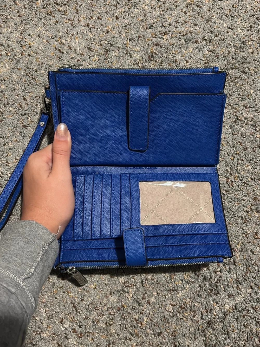 Michael Kors Adele Double-Zip Wristlet in a bright blue